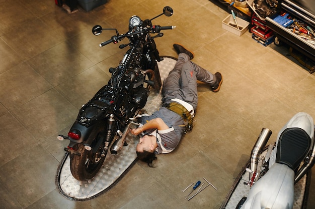 Mechanic repairing vehicle