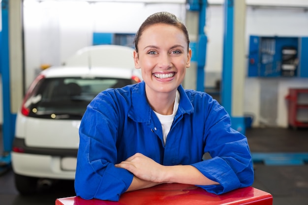 Mechanic smiling at the camera