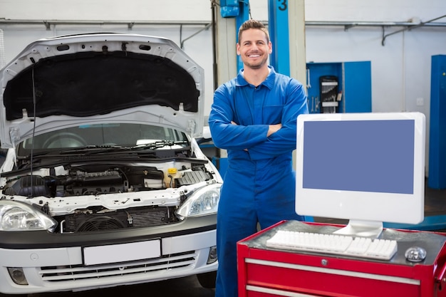 Mechanic smiling at the camera