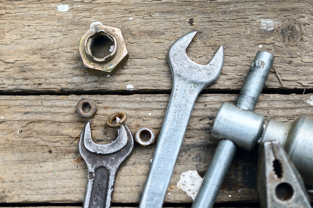 Mechanic tools on wooden surface