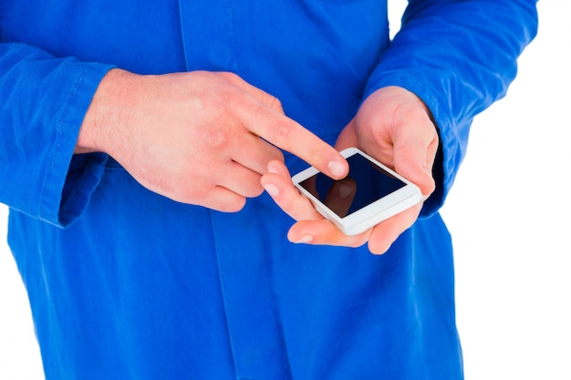 Mechanic using his mobile phone