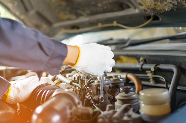 Mechanic with Stainless Steel Wrench in Hand