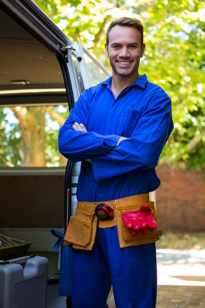 Mechanic with a tool belt around waist