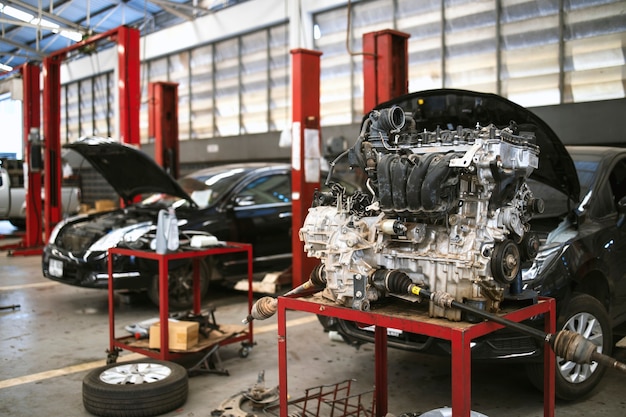 Mechanic working car maintenance with soft-focus and over light in the background