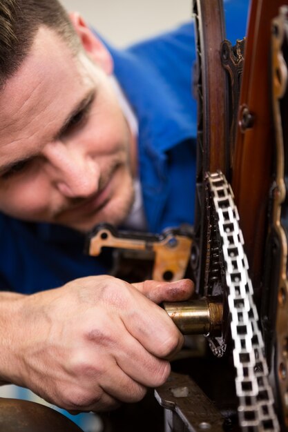 Mechanic working on an engine at the repair garage