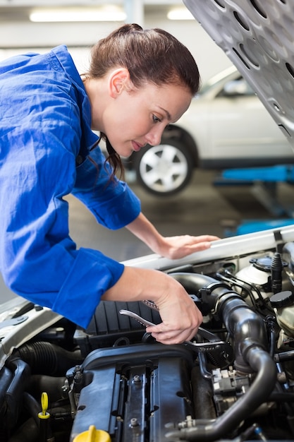 Mechanic working under the hood 