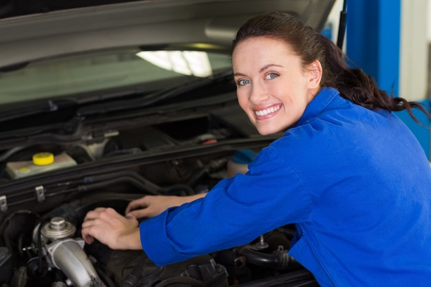 Mechanic working under the hood 