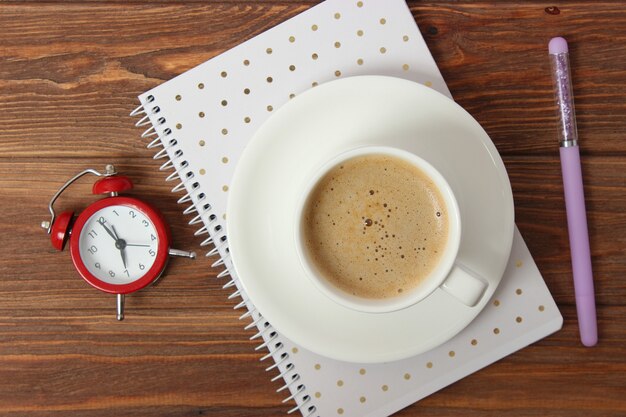 Mechanical alarm clock on a colored background