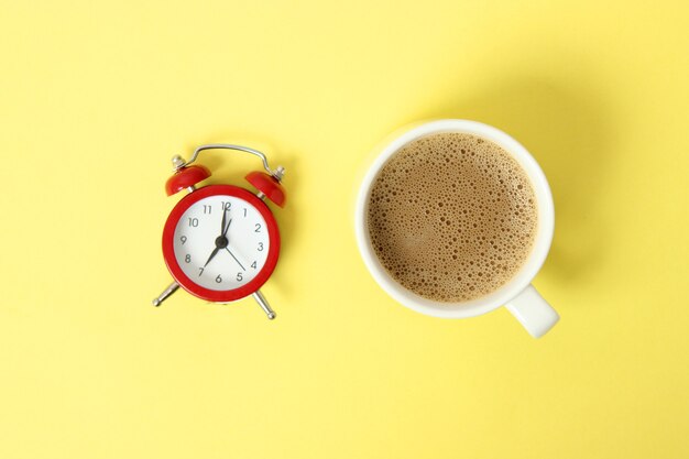 Photo mechanical alarm clock on a colored background