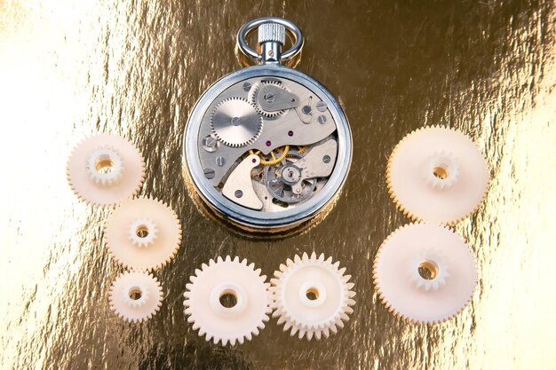 Photo mechanical analog stopwatch on a colored background time part precision measurement of the speed interval