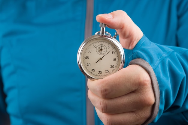 Mechanical stopwatch in hand Time part precision Measuring the speed interval with a watch