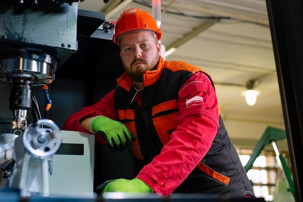 Mechanical technician operative of cnc milling cutting machine center at tool workshop