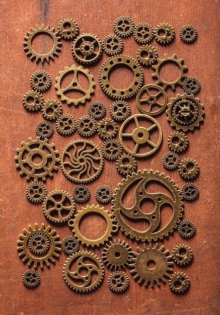 Mechanische de radertjes van Steampunk past wielen op houten achtergrond aan