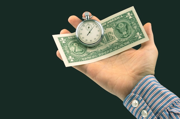 Mechanische stopwatch en dollars in de hand van de man Parttime nauwkeurigheid voor zakelijke en financiële tijd
