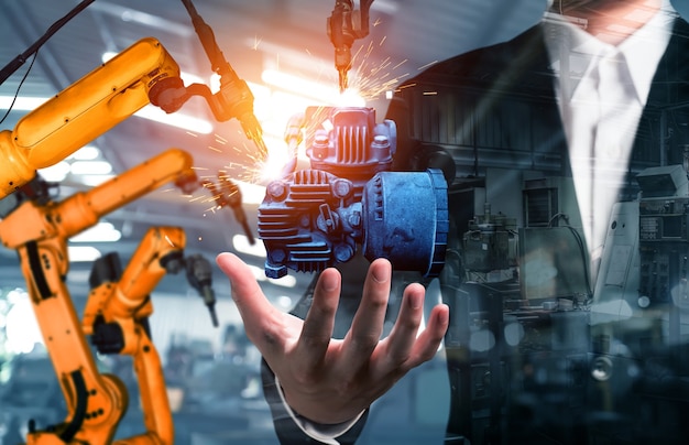 Mechanized industry robot arm and factory worker double exposure