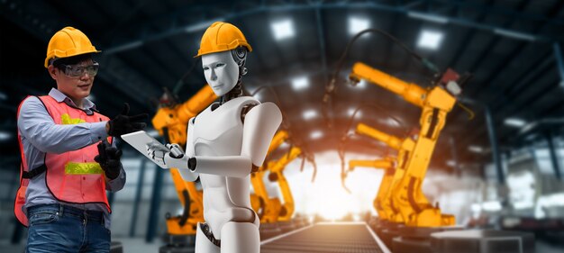 Robot industriale meccanizzato e lavoratore umano che lavorano insieme nella futura fabbrica