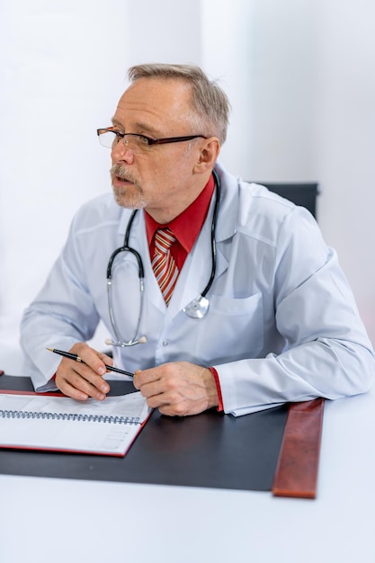 Medic in office. doctor talks about results of a patient`s\
health diagnosis. discussing health care issues.