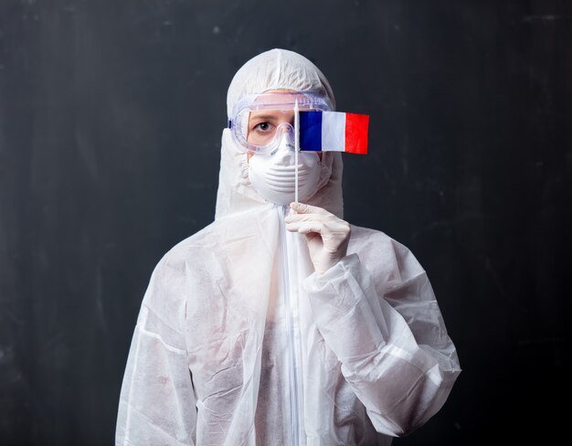 Medic woman wearing protective clothing against the virus with France flag