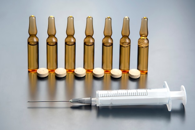 Medical ampoules for injection, tablets and syringe.