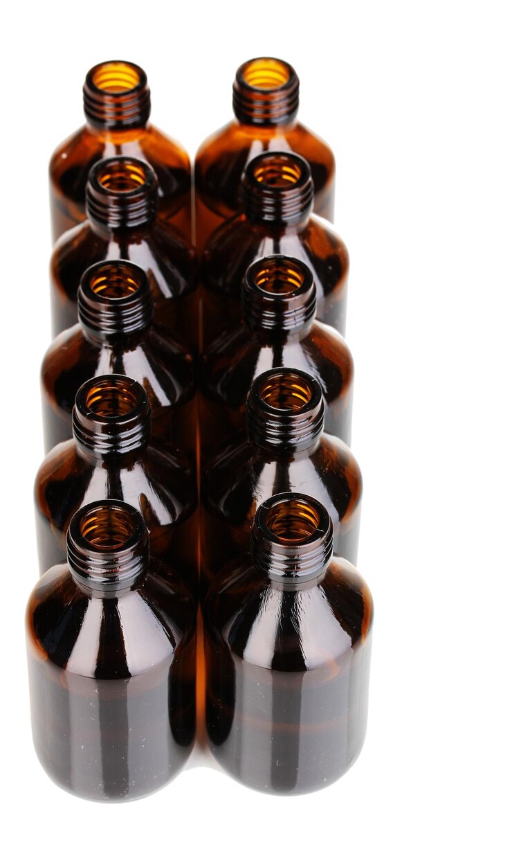 Photo medical bottles in the row isolated on white