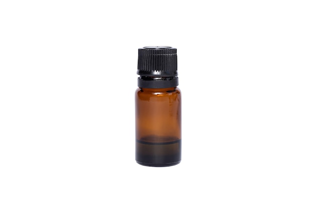 Medical brown glass oil jar with black lid on white isolated surface