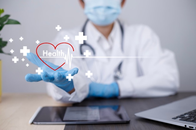 Photo medical business and health insurance doctor woman holding red heart shape in hand with medical icon modern network connection virtual and medical insurance hospital service and healthcare