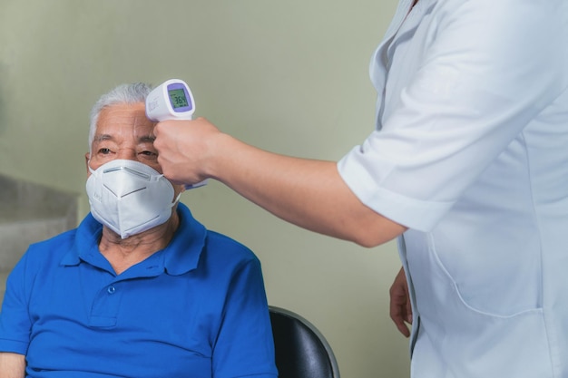 Medical checkup of an older man checking his vital signs