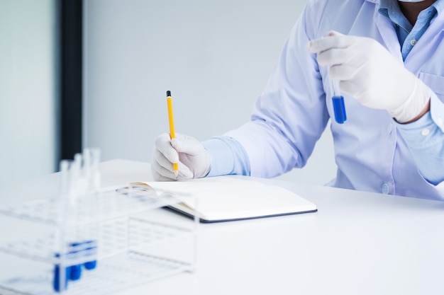 medical chemist / scientist student  experiments test tube in laboratory