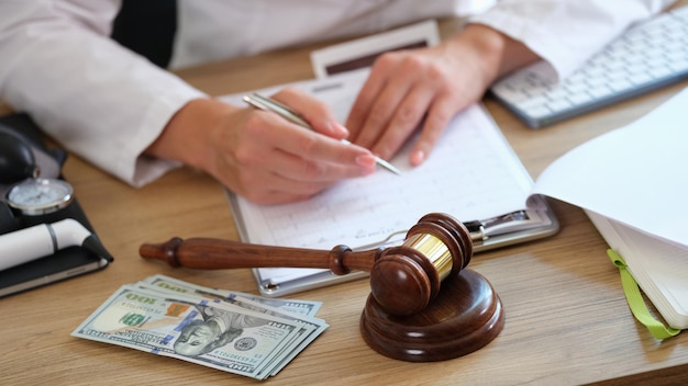 Medical clinic lawyer works with health insurance and financial documents at his desk man