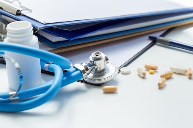 Medical clipboard on the white table