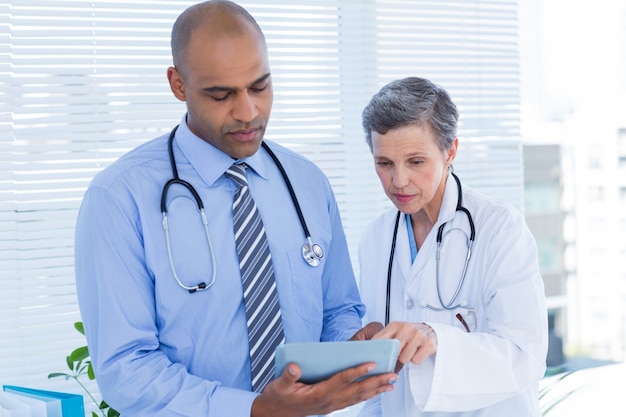 Medical colleagues working with tablet computer