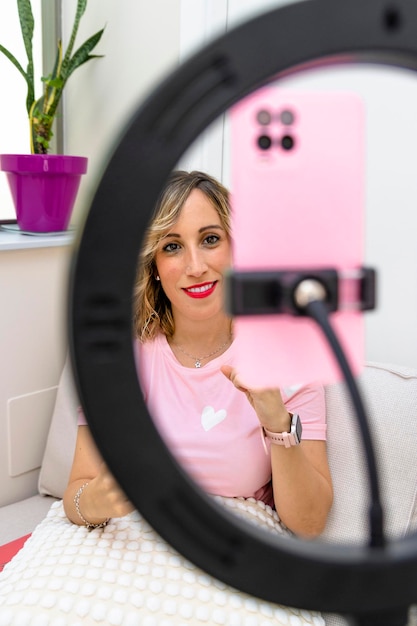 Medical consultation Dietician and nutritionist Young woman dressed in pink making a video of herself