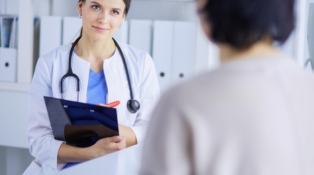 medical consultation in a hospital doctor listening to a patient's problems