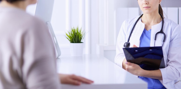 Medical consultation in a hospital Doctor listening to a patient's problems