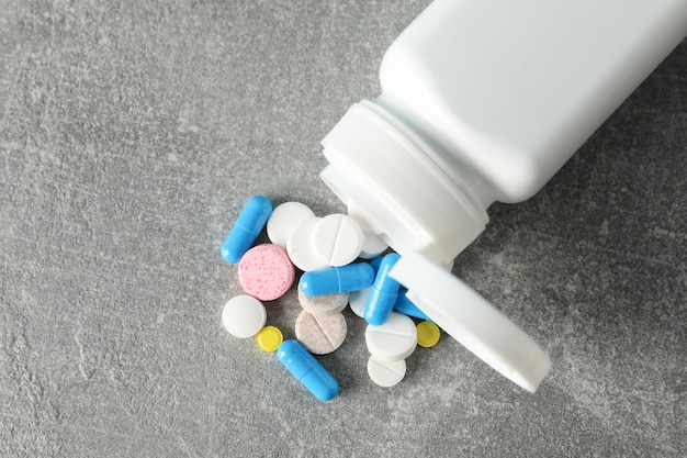 Medical container and pills, close up