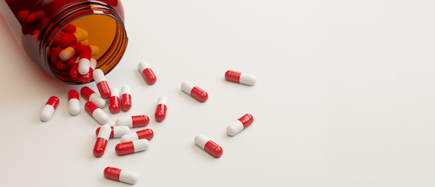 Medical container and pills on white surface