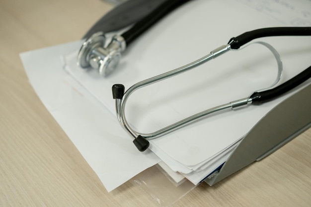 Medical device statoscope on the doctor's desk for listening to the heartbeat and breathing the doc