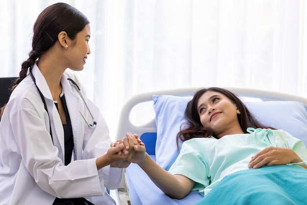 Medical doctor hold patient hand