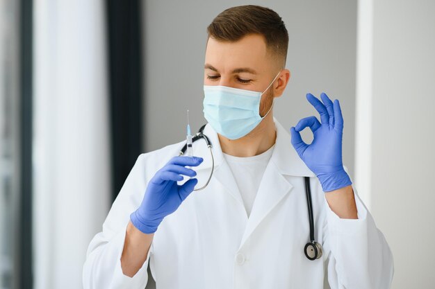 Medical doctor holds vaccine for a patient