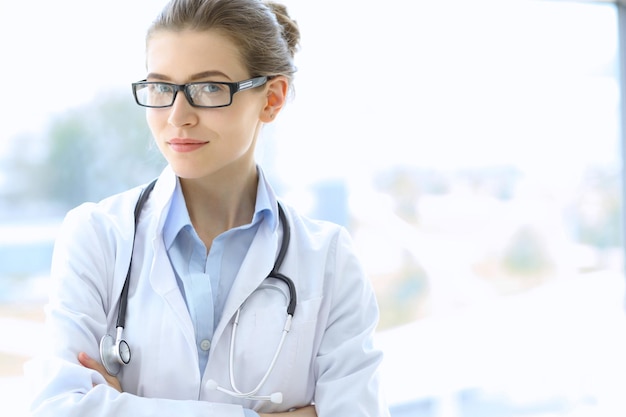 Medical doctor woman over clinic interiers background