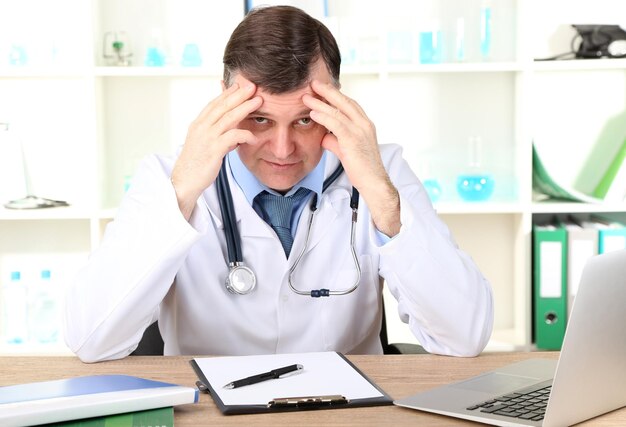 Medical doctor working at desk