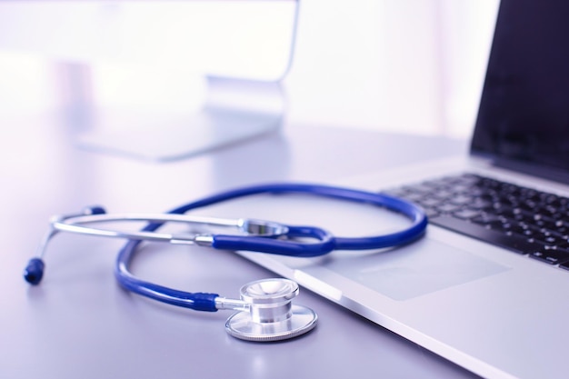 Medical equipment blue stethoscope and tablet on white background Medical equipment