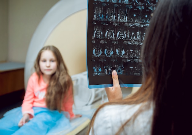 Medical equipment. Doctor and patient in MRI room at hospital