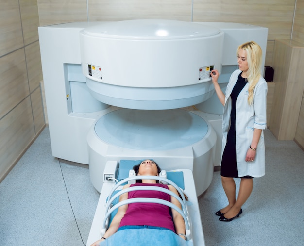 Medical equipment. Doctor and patient in MRI room