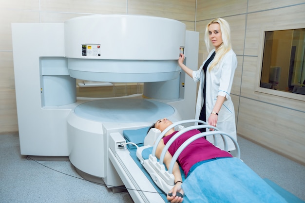 Medical equipment. Doctor and patient in MRI room