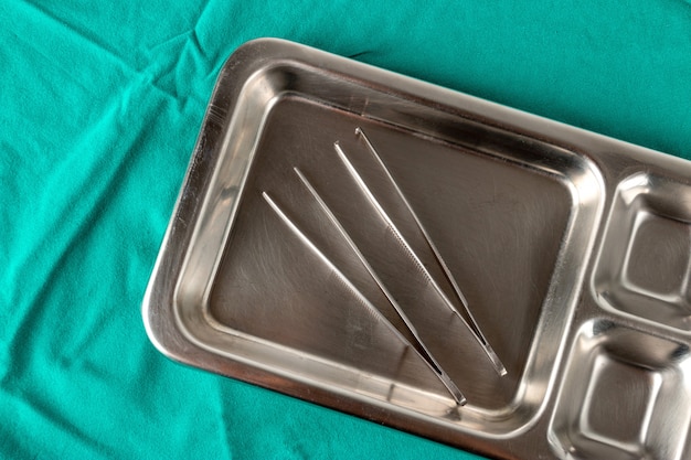 Medical equipment on a green cloth in the operating room