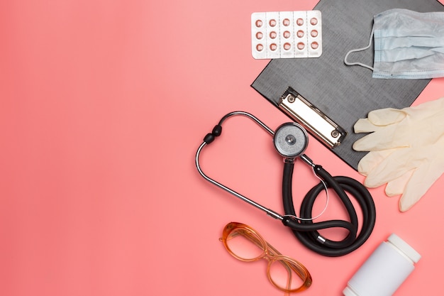 Medical equipment on a pink pastel .