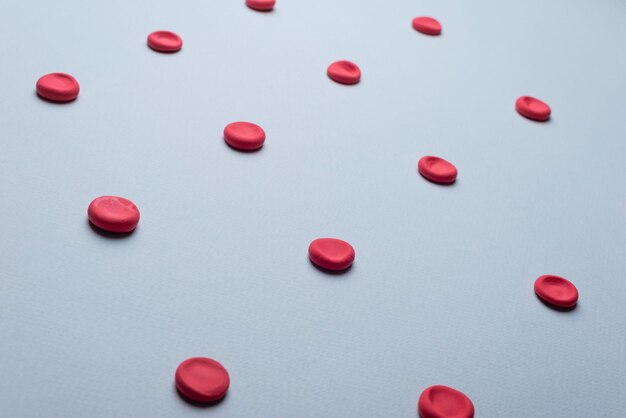 Medical flatlay erythrocytes on a blue background