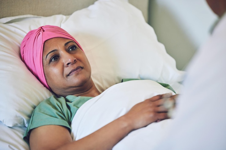 Photo medical healthcare and cancer with muslim woman in bed at hospital for treatment or recovery islam medicine or sad person in hospice with a sick or tired mature patient in clinic for chemotherapy