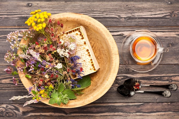 Medical herbs and flowers and herbal tea top view horizontal